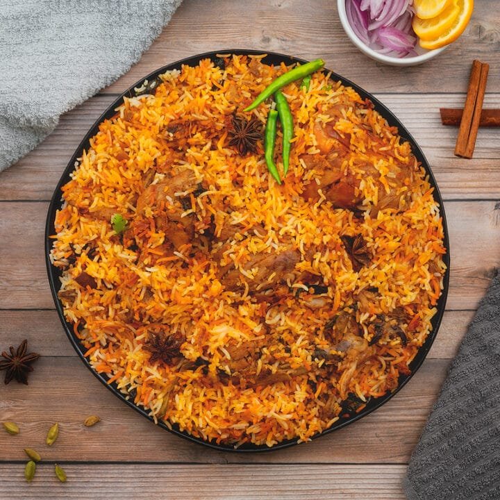 Mughlai Biriyani made with spiced chicken chunk along with basmati rice.