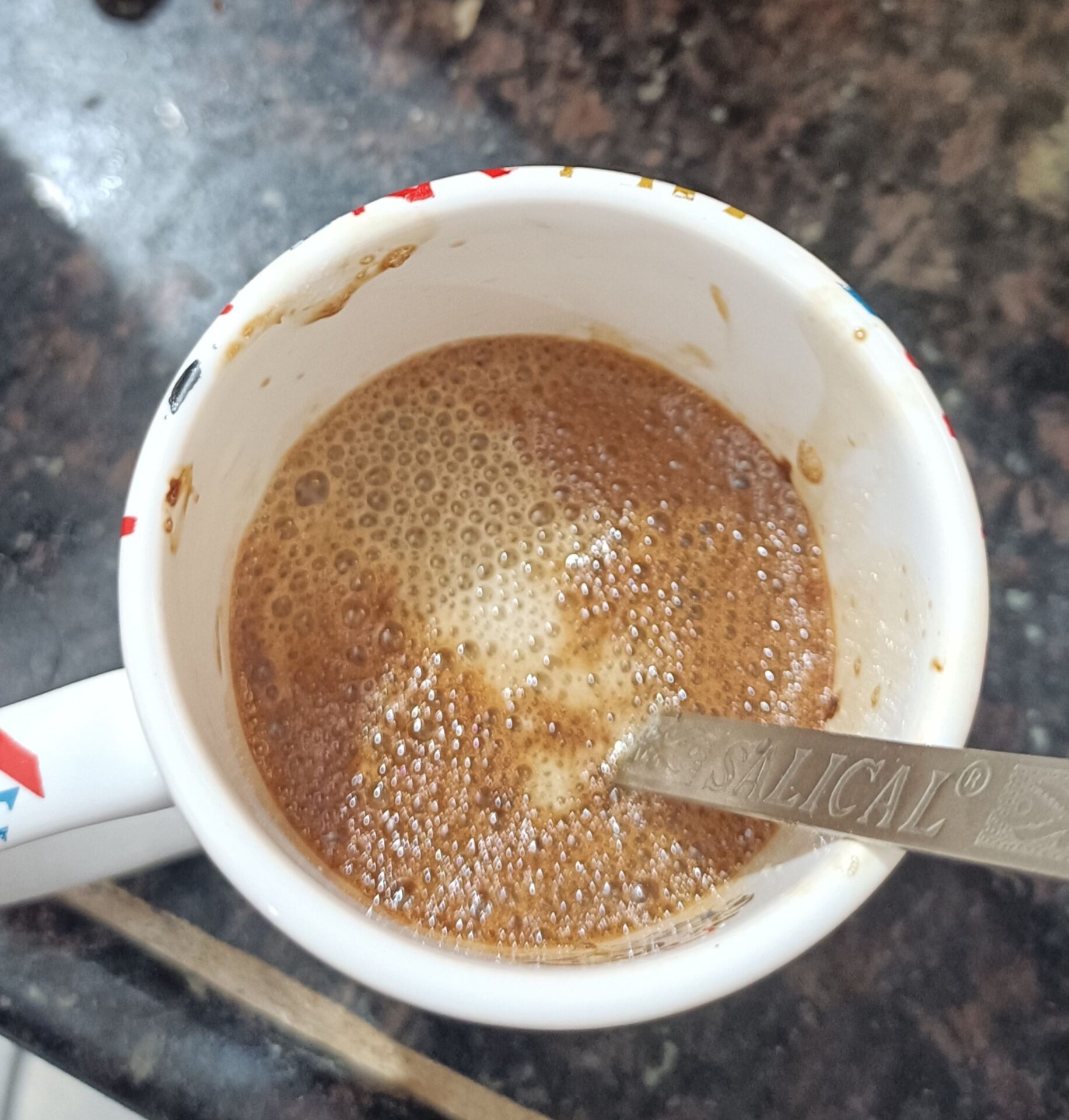 add boiled milk to coffee cup